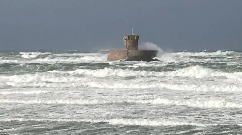 Fierce waves batter the beach at St Ouen.