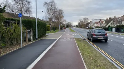 Phil Shepka/BBC Milton Road in Cambridge showing the cycle land next to the road