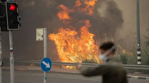 security officer near fire near road