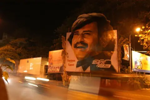 The India Today Group via Getty Images Posters and other displays of Rajnikanth's film Shivaji are visible at and around Abhirami Multiplex where the film is being screened in Chennai, Tamil Nadu, India (Photo by Hk Rajashekar/The The India Today Group via Getty Images)