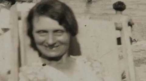 PA Media Louisa Dunne smiling at the camera