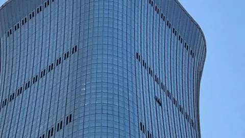 The collision left holes on the side of the CITIC Tower