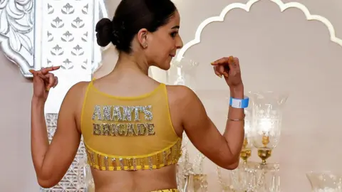 Reuters bridesmaid Ananya Panday has her back facing the camera, on her top are the words 'annats brigade'.