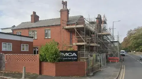 External view of the Kirkham Baths building which suffered storm damage in 2021. There is scaffolding at the front of the building.