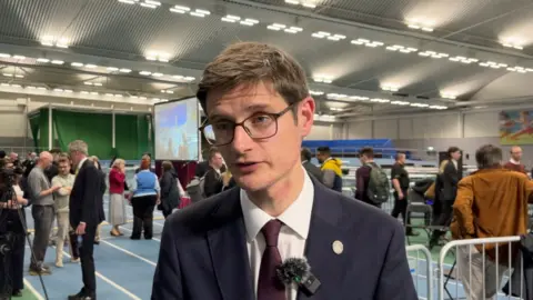 Outgoing council leader Tom Hunt reacts to losing his seat