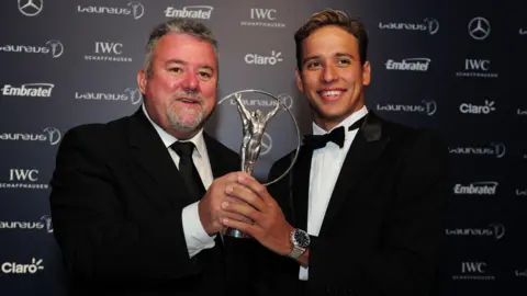 Getty Images Bert and Chad pose with a 2013 Laureus World Sports Award in Rio