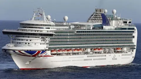 Getty Images Large white cruise ship, Ventura at sea, with union flag logo on the bow