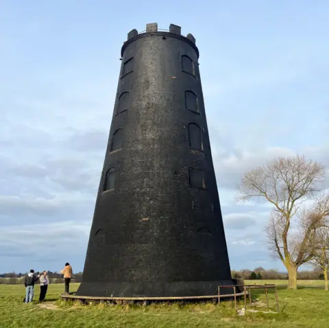Gill Sennett / BBC The Black Mill on Beverley Westwood. The sky is blue.