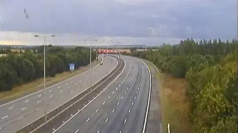 Highways England The A1M near Alconbury Hill showing a three lane southbound carriageway empty of traffic after a serious collision