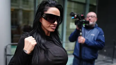 AARON CHOWN/PA WIRE Katie Price leaving court on Tuesday