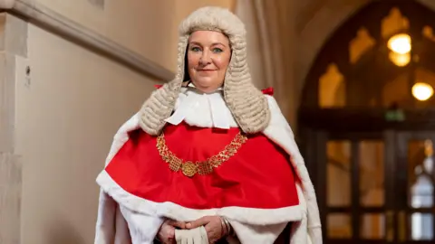 PA Media Lady Chief Justice stood in the centre of the picture, wearing ceremonial robes and a traditional judges' wig