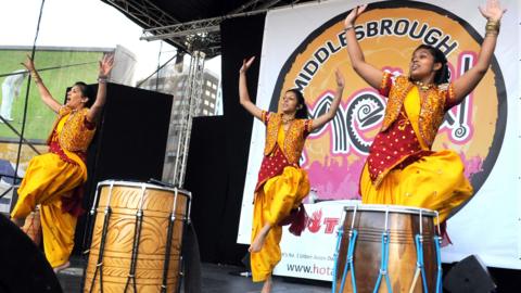 Performers on stage at the Middlesbrough Mela