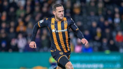 Billy Sharp runs on the pitch during a game for Hull