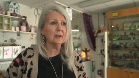 Jacky Blakeney Woman in Crystal shop 