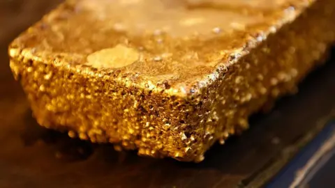 large bar of unrefined gold