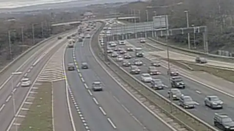 A grainy photo of traffic building up on the M6