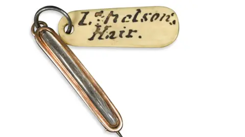 Cheffins A memorial brooch containing a lock of hair from the head of Admiral Lord Nelson