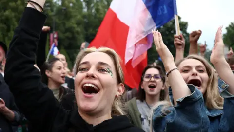 Reuters Cheering and chanting women  from far-left opposition party La France Insoumise celebrate their surprise win.