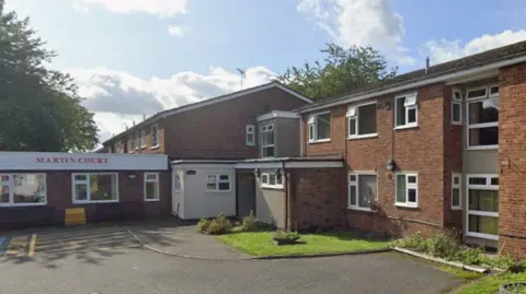 Martin Court in Antsey with blue sky above