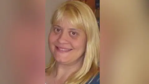 Surrey Police A picture of a woman with blonde hair.