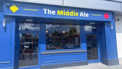 The blue front of The Middle Ale