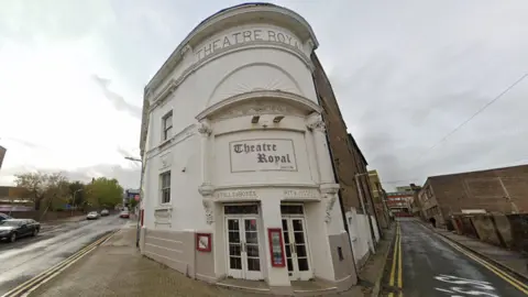 An external shot of the Theatre Royal in Margate - which is a white building on the corner of two roads