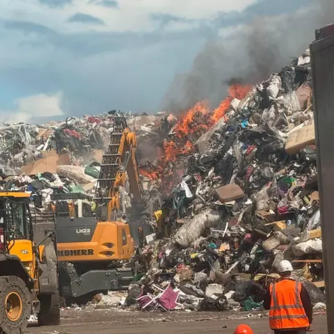Fife Jammer Locations A large pile of landfill with orange flames spreading 