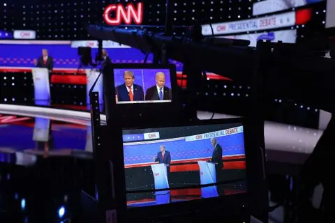 Justin Sullivan/Getty Images Cameras show former US President Donald Trump and President Joe Biden on the debate stage