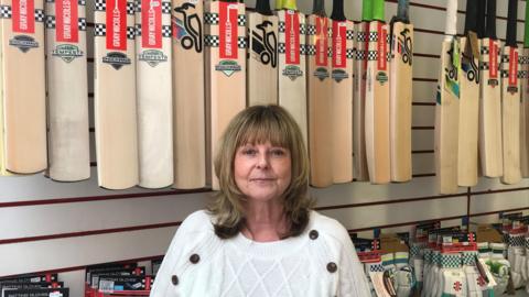 Owner Angela Price standing in her sports shop 