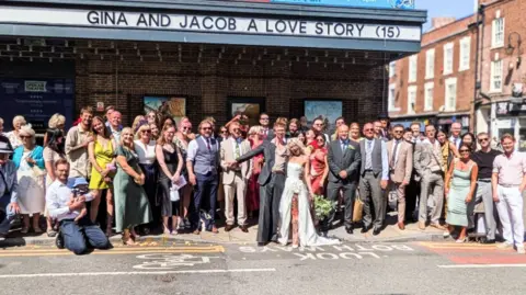 Hope House The couple pictured surrounded by guests