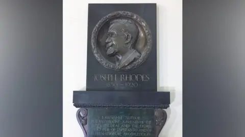 Skipton Esperanto Group A plaque of Yorkshire journalist Joseph Rhodes in a musuem 