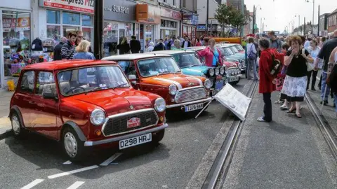 David Dixon/Geograph Visitors surround an exhibit of classic Minis 