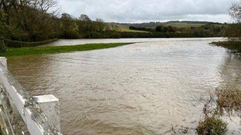 The flooded Cuckmere river at Alfriston, East Sussex