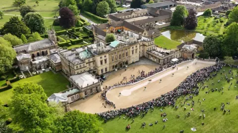 A general view via a drone of horses being inspected in front of Badminton House on day one of the MARS Badminton Horse Trials 2025 at The Badminton Estate, Gloucestershire. 
