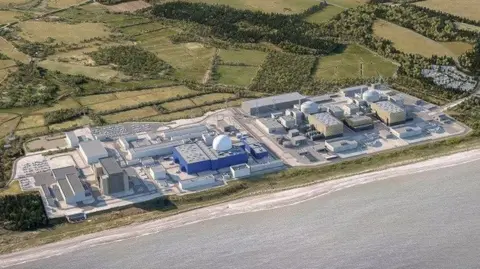 Environment Agency An artist's impression of Sizewell C on the Suffolk coast. The large nuclear power station is spread across a large site with numerous different buildings. Green fields have been drawn behind it while the coastline sits in front of the site.