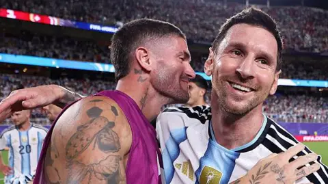 Rodrigo de Paul and Lionel Messi