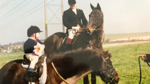 Family photo Tom the toddler on his pony