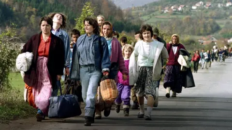 Getty Images Bosnian women displaced by the war of independence from Yugoslavia pictured in October 1992