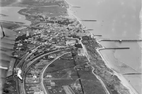 Historic England Archive / Aerofilms Collection An aerial view of Walton-on-the-Naze and the Tendring Hundred Railway, Essex, taken in June 1920