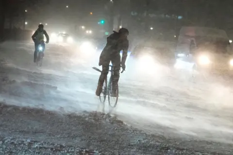 Getty Images Cyclists in Aalborg, Denmark, during heavy snowfall. Some parts of eastern Denmark could see up to 70cm (26 inches) of snow by Thursday.
