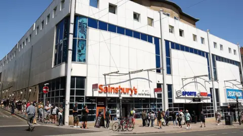Getty Images Queue at Sports Direct in Brighton