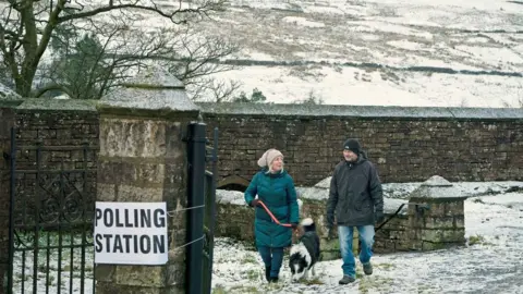 PA Media Snow at a polling station in Nenthead, Cumbria