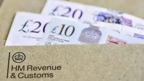 Getty Images Cash in HMRC envelope