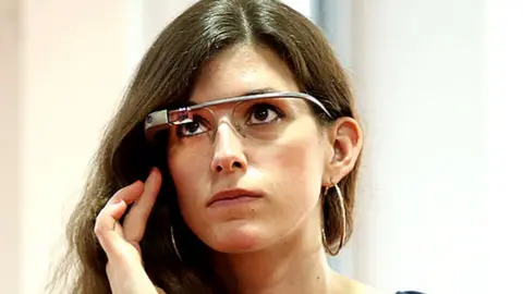 Getty Images A woman wears Google Glass at book presentation