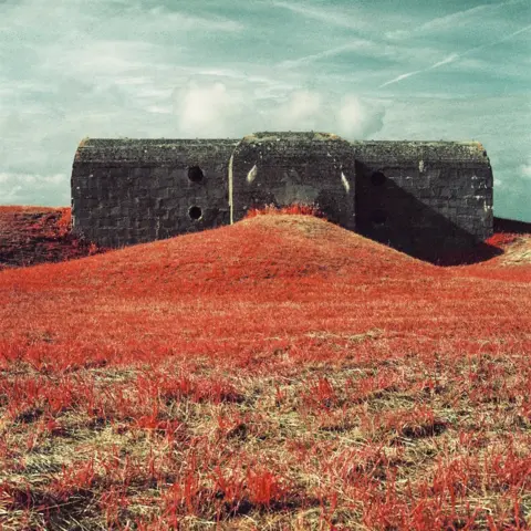 Lynda Laird Infrared photograph of a bunker, surrounded by grass