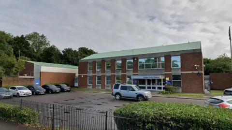 Google The current Canley Police Station made of brick and glass with a green roof