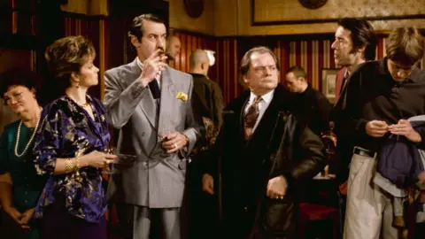 Getty Images Actors (L-R) Sue Holderness, John Challis, David Jason, Roger Lloyd-Pack and Nicholas Lyndhurst in a pub scene