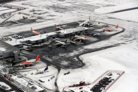 PA Aerial view of a snow covered Newcastle Airport