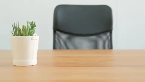 Getty Images Empty desk