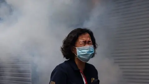 AFP Tear gas is fired to disperse a protest in Hong Kong in May